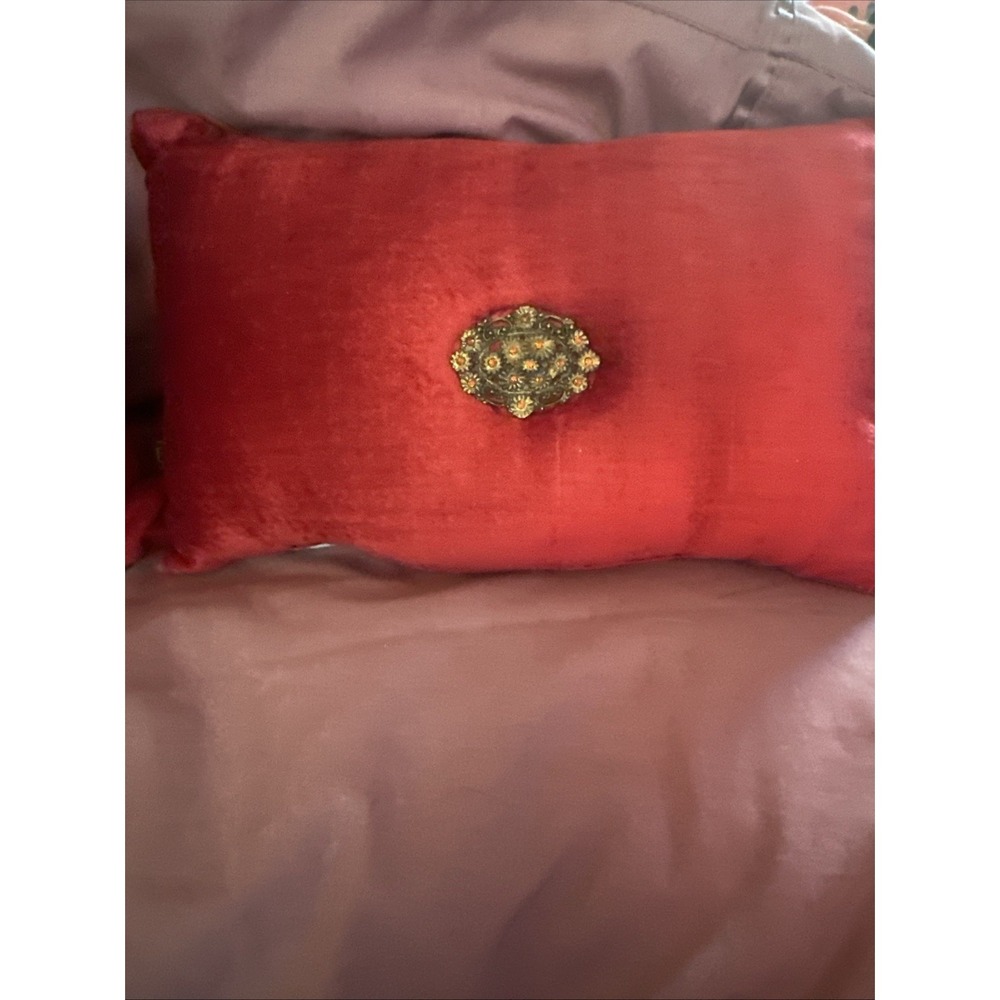 Borgata red velvet throw pillow gold-toned vintage brooch pinned to the center